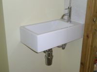 Rectangular basin with mixer tap