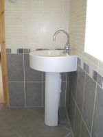 Round basin and pedestal with mixer tap