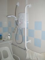Disabled shower with rails and seat